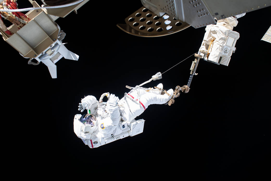 Astronaut Luca Parmitano rides the Canadarm2 robotic arm