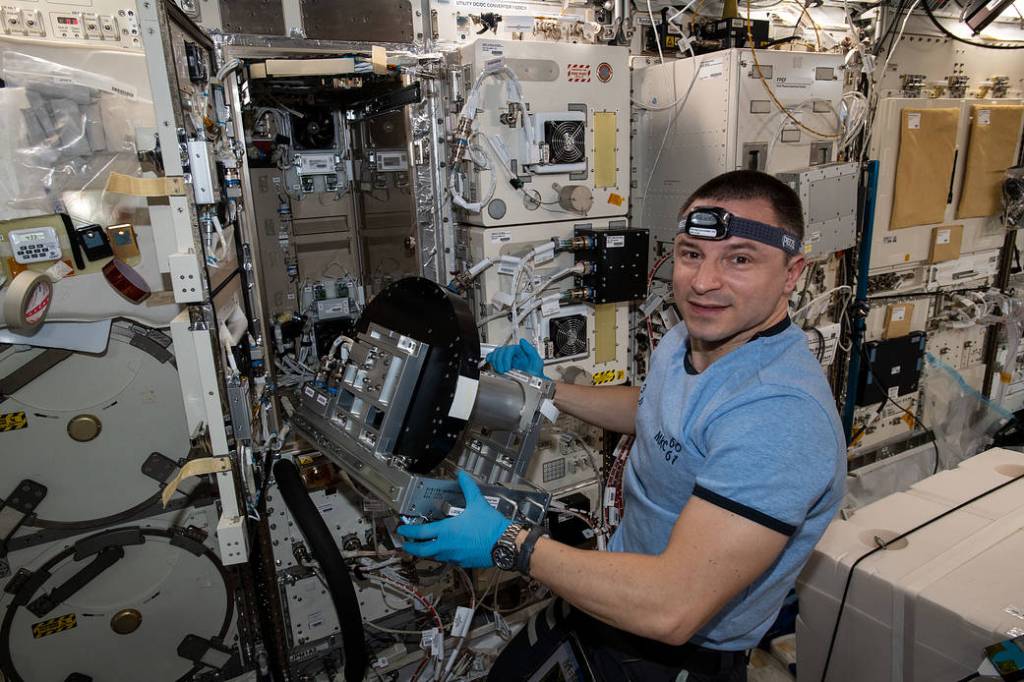 NASA astronaut Andrew Morgan installs a new artificial gravity generator