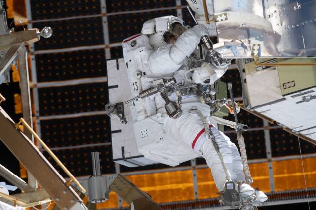 Astronaut Jessica Meir is outfitted with spacewalking tools