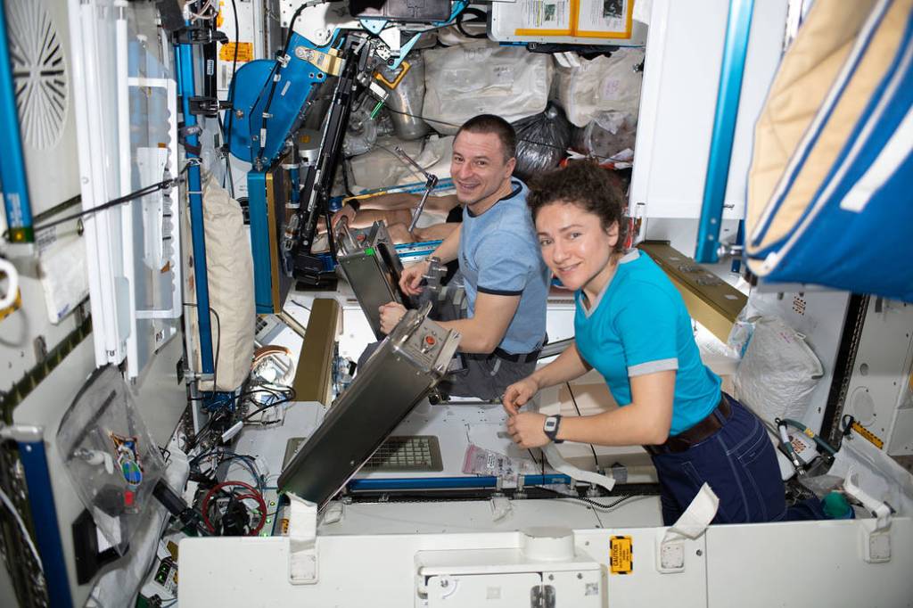Astronauts Jessica Meir and Andrew Morgan work on orbital plumbing tasks
