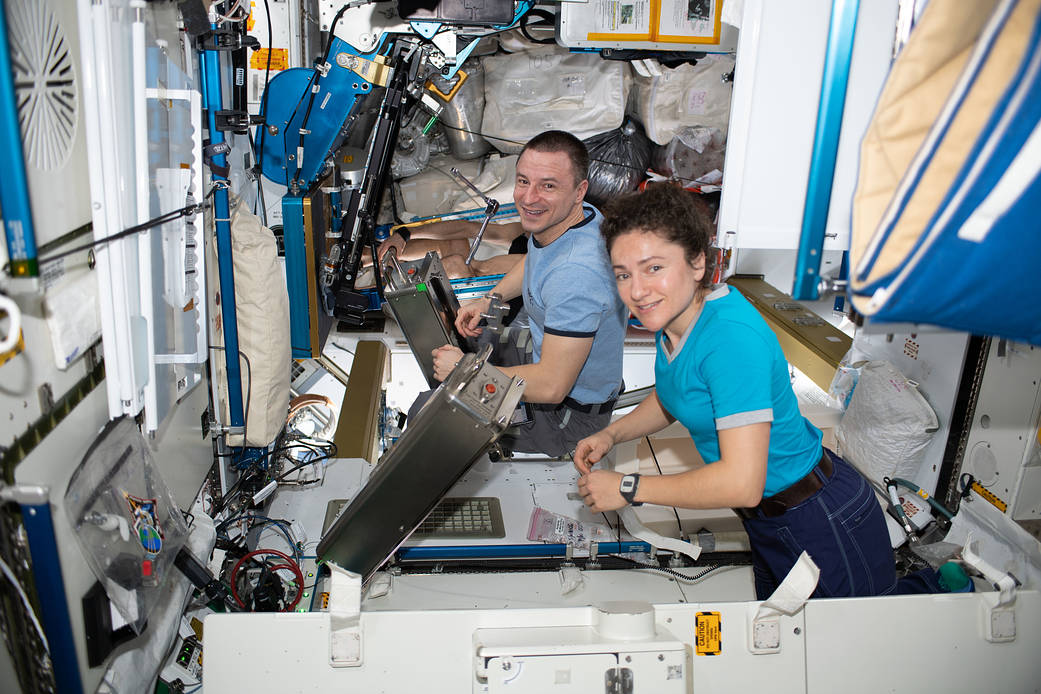 Astronauts Jessica Meir and Andrew Morgan work on orbital plumbing tasks