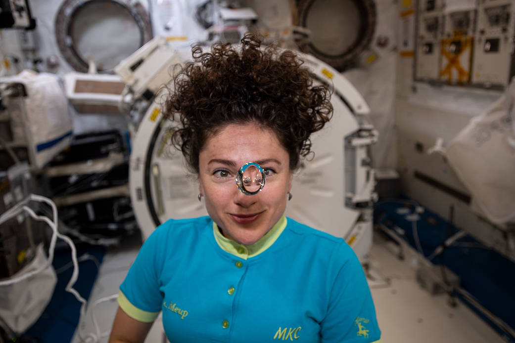 Flight Engineer Jessica Meir observes a floating sphere of water