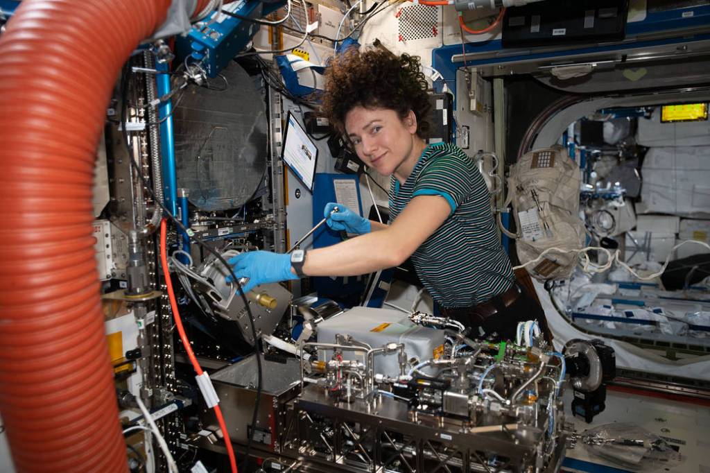 NASA astronaut Jessica Meir works on orbital plumbing tasks