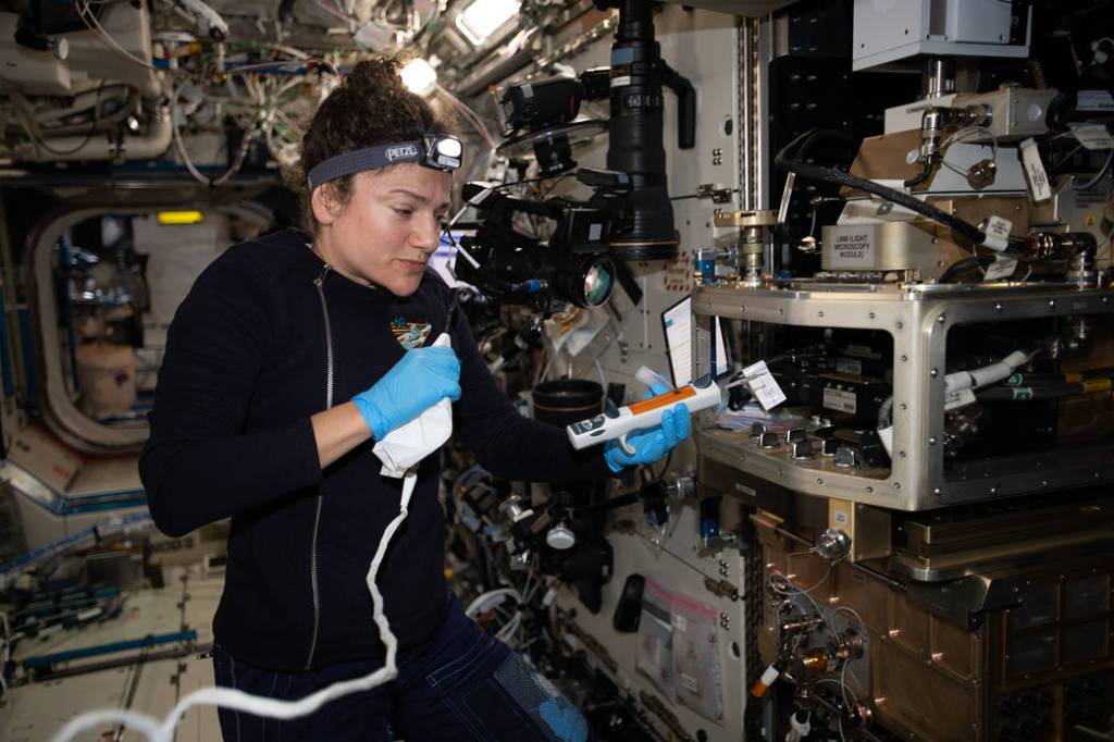 NASA astronaut Jessica Meir configures the Light Microscopy Module
