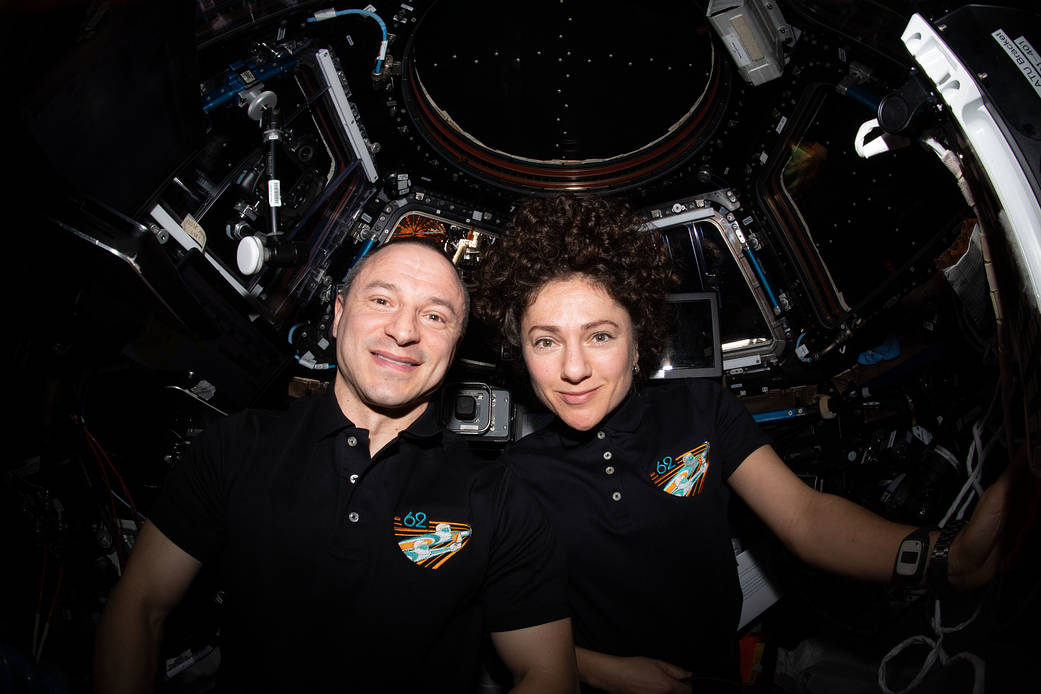 NASA astronauts Andrew Morgan and Jessica Meir pose for a portrait inside the cupola