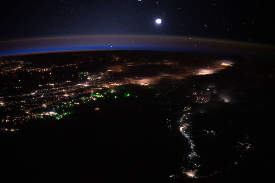 The city lights and boat lights of Malaysia and Indonesia
