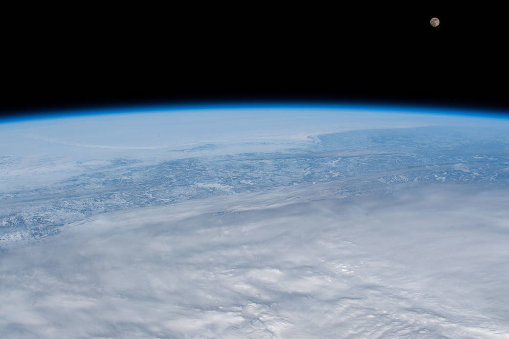 A waxing gibbous Moon above the Earth