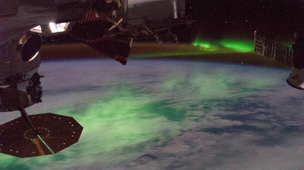 The "aurora australis" glows beneath the International Space Station
