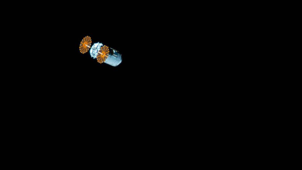 The Cygnus space freighter begins its separation from the International Space Station