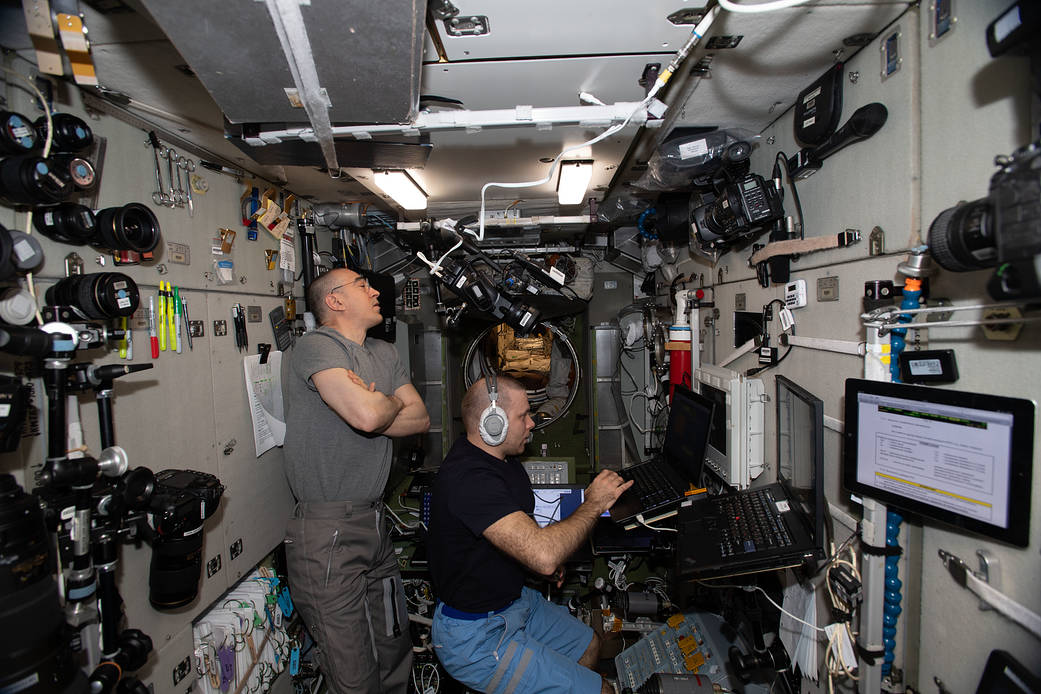 Cosmonauts Anatoly Ivanishin and Ivan Vagner practice a simulated emergency