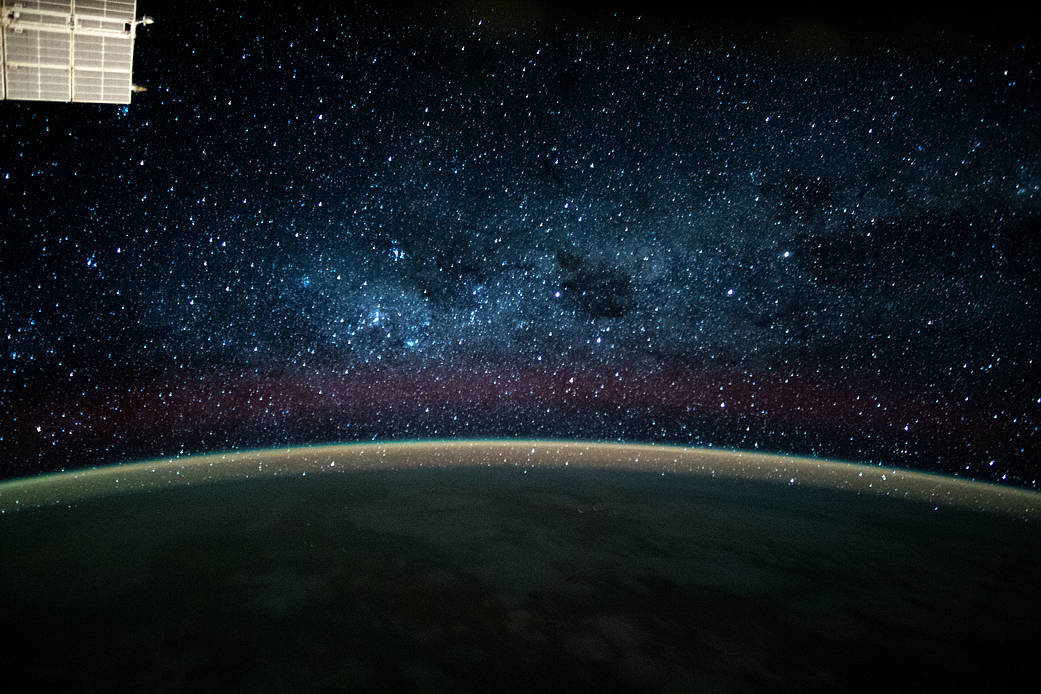 The Milky Way glittering above Earth's horizon