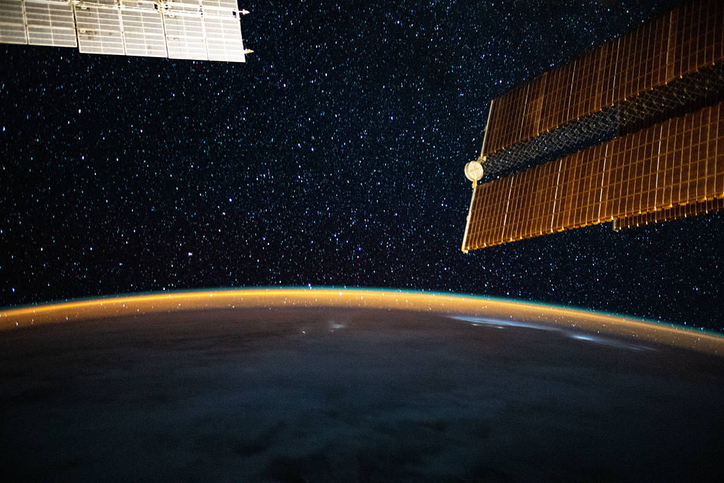 The Milky Way glitters above the Earth's horizon
