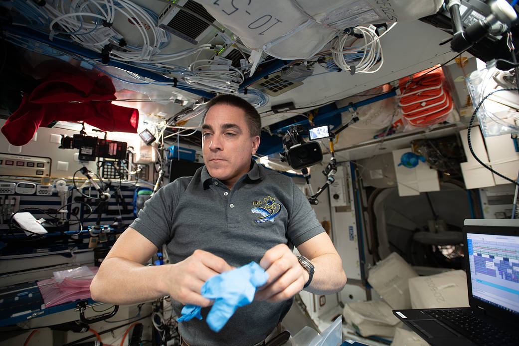 Expedition 63 Commander Chris Cassidy conducts research activities