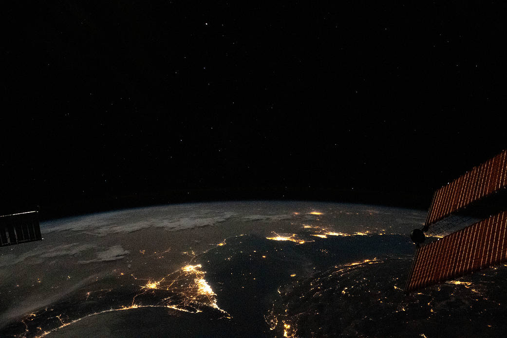 The well-lit United Arab Emirates with Qatar and Bahrain