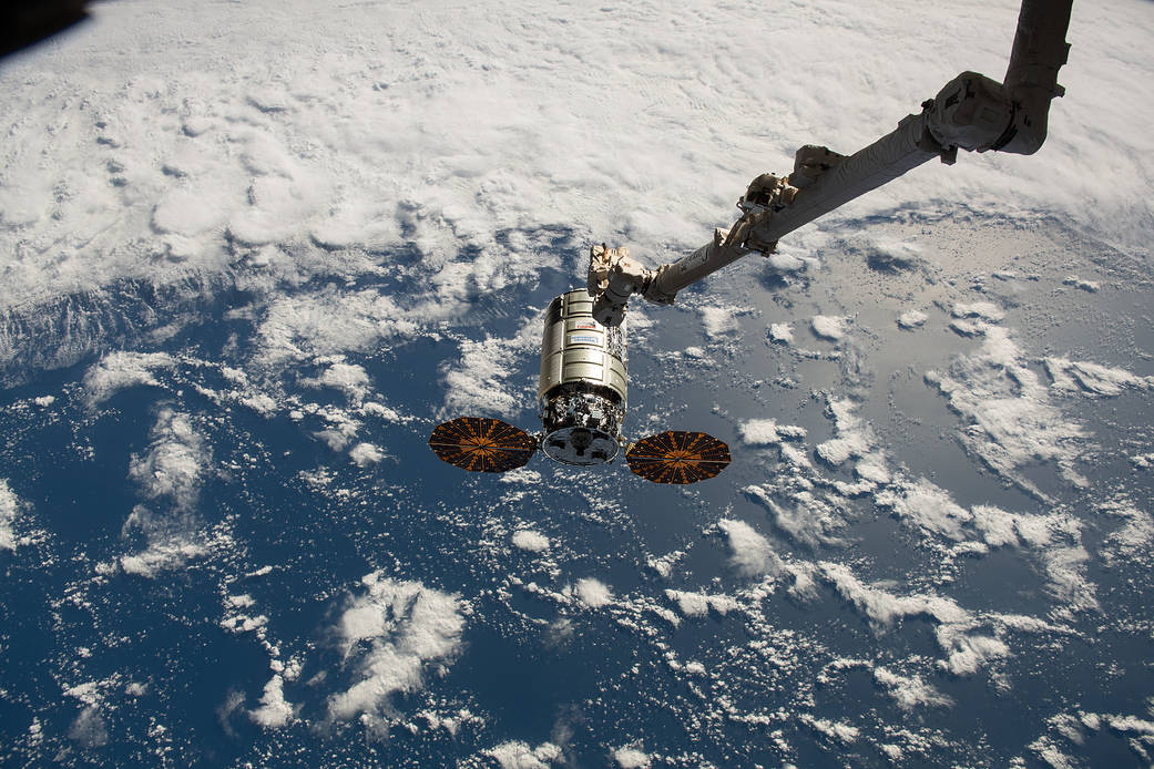 The Cygnus space freighter approaches the space station