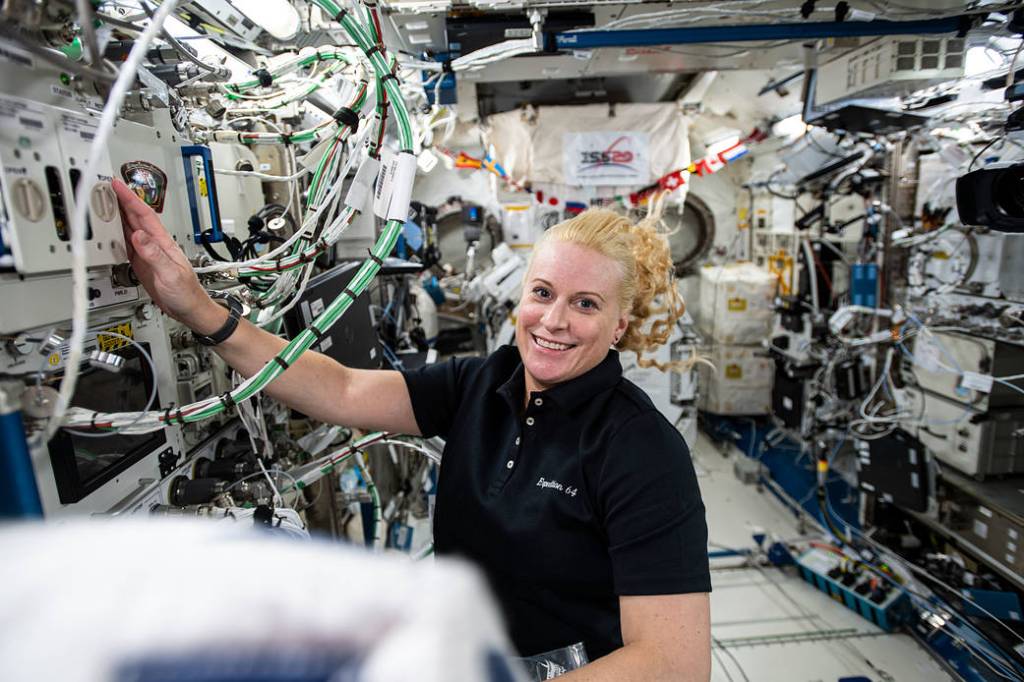 Expedition 64 Flight Engineer Kate Rubins works on research hardware