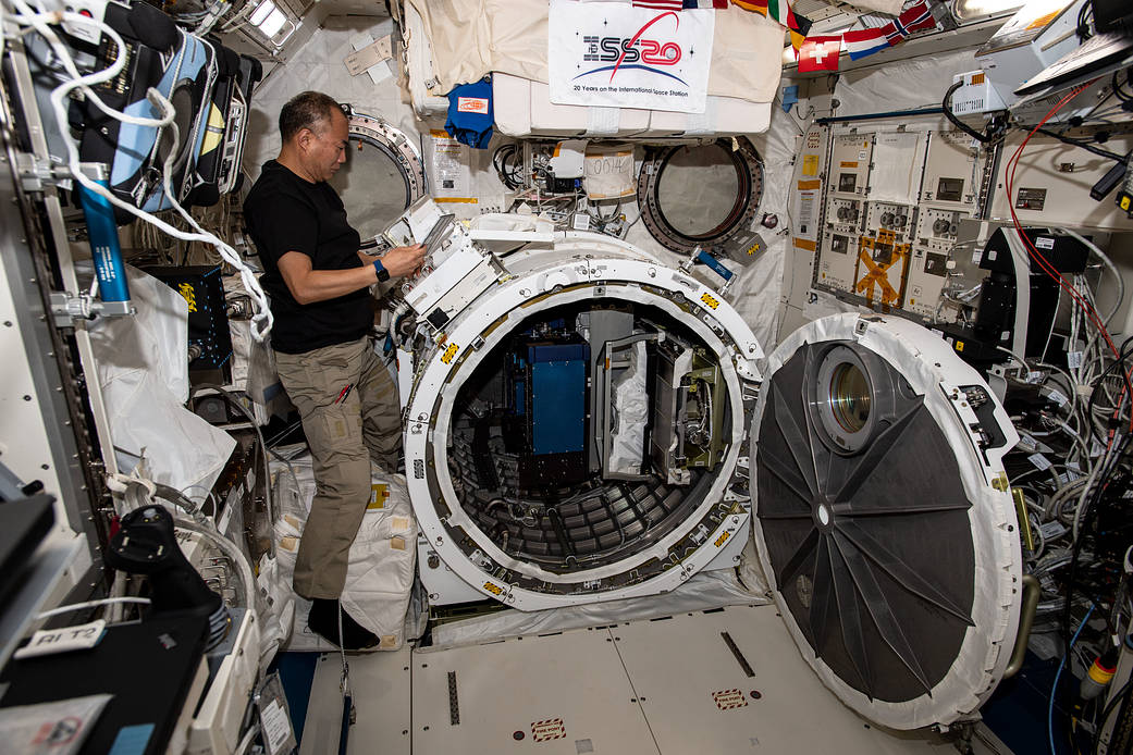 Astronaut Soichi Noguchi reviews external experiment hardware procedures