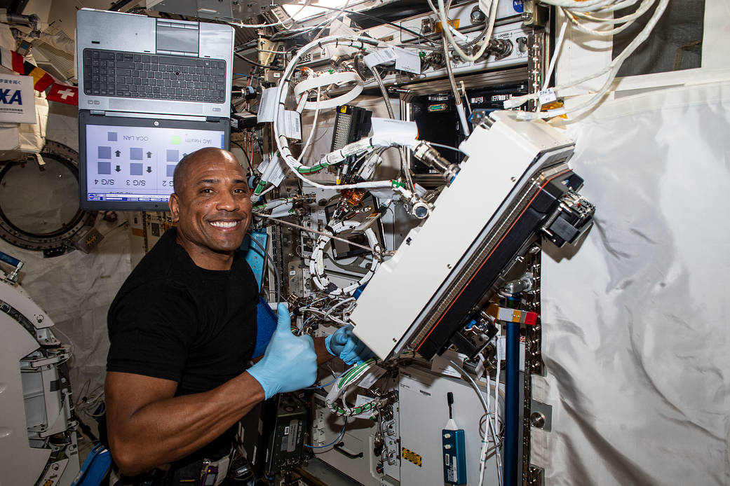 Expedition 64 Flight Engineer Victor Glover installs biology research gear
