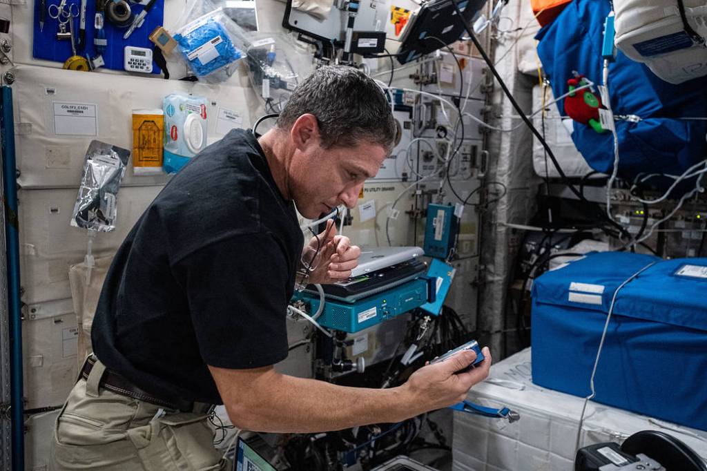 Expedition 64 Flight Engineer Michael Hopkins checks on biological samples