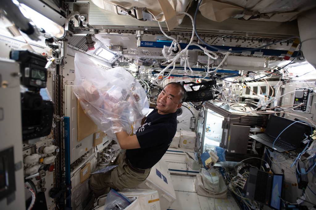 Astronaut Soichi Noguchi mixes samples for a biomedical study