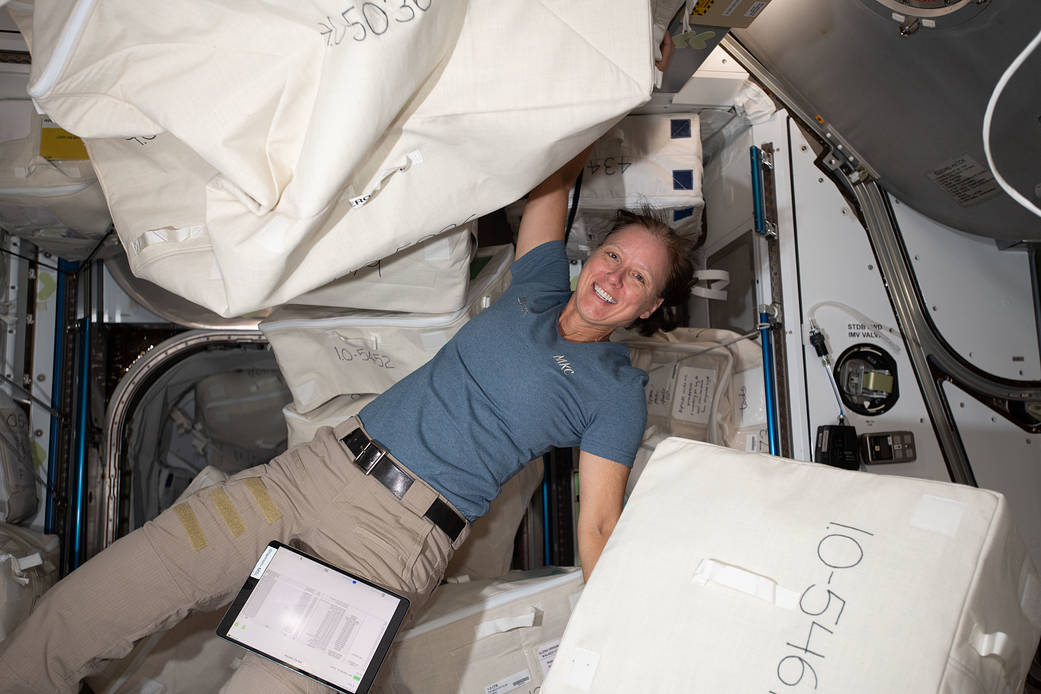 Astronaut Shannon Walker unpacks spacewalk hardware