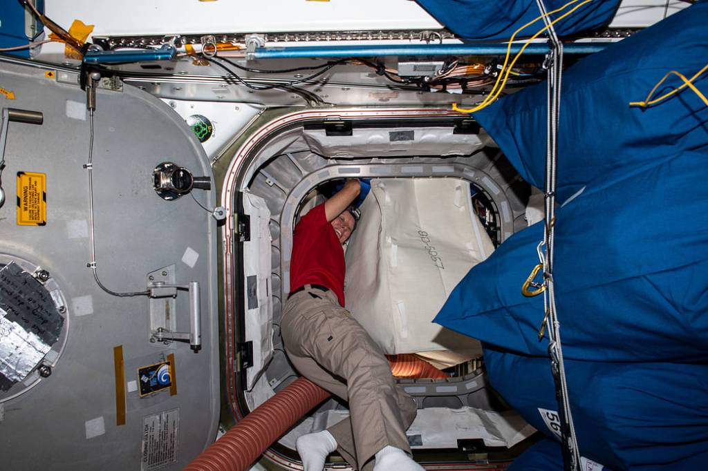 NASA astronaut Shannon Walker packs the Cygnus space freighter