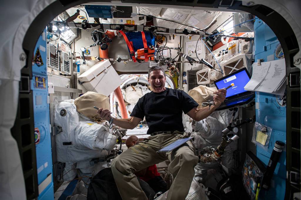 Flight Engineer Michael Hopkins works inside the Quest airlock