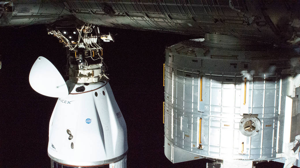 The SpaceX Cargo Dragon resupply ship docked to the space station