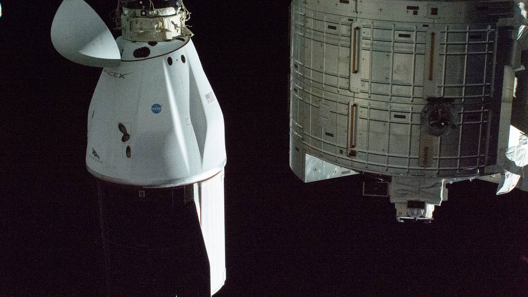 The SpaceX Cargo Dragon resupply ship docked to the space station