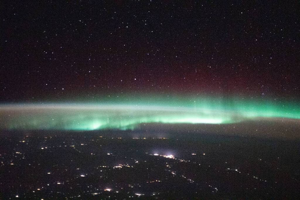 A starry night sky and an aurora above Russia