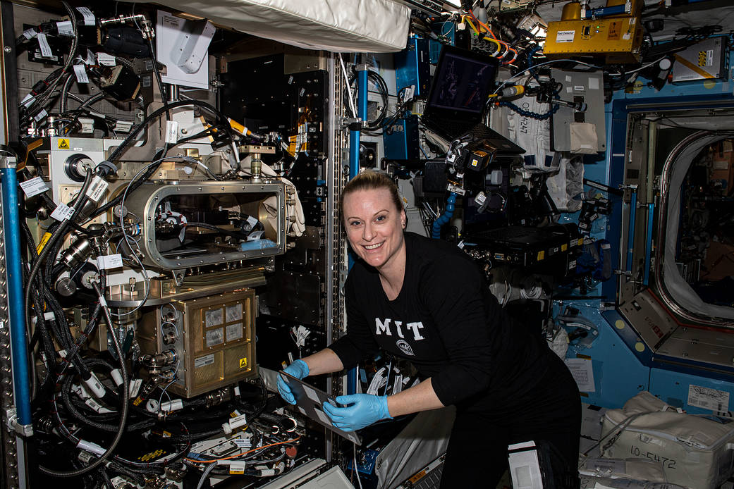 NASA astronaut Kate Rubins sets up the ACE-T-Ellipsoids study