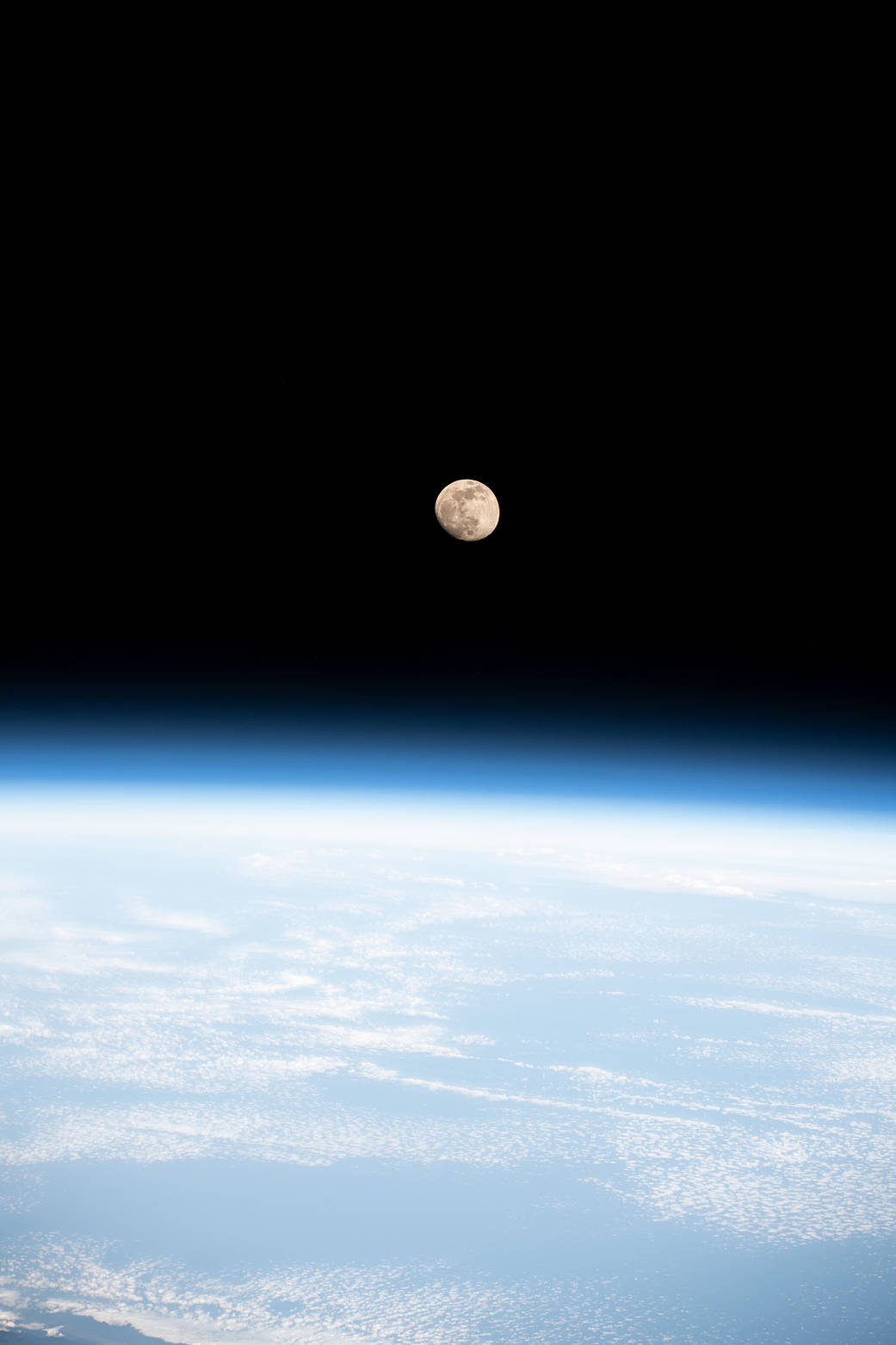 The waxing gibbous Moon above the South China Sea