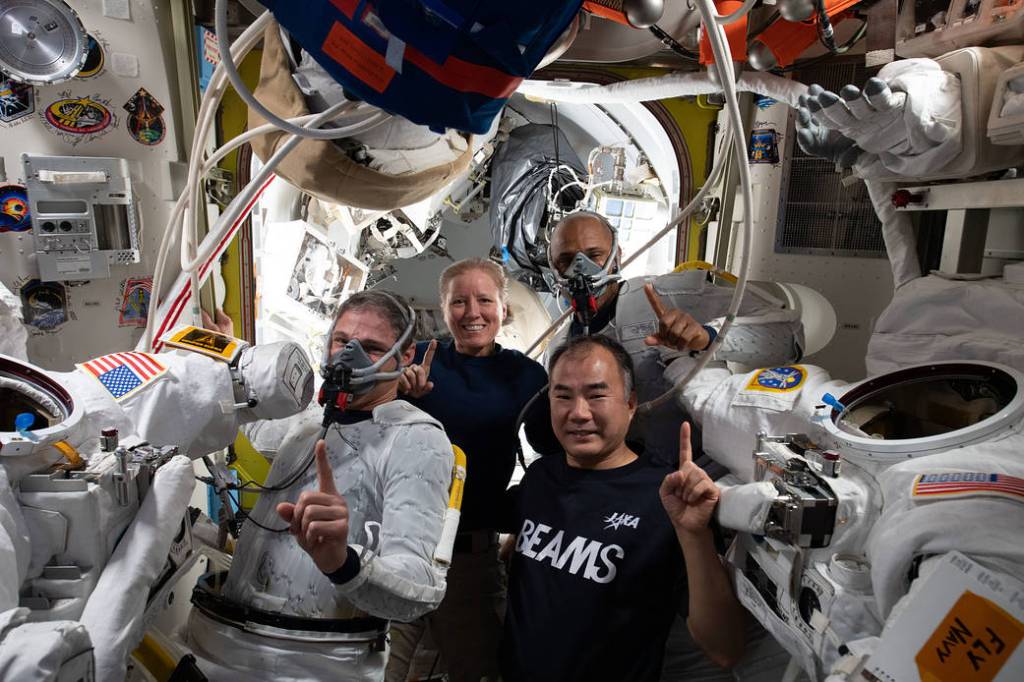 SpaceX Crew-1 members during spacewalk preparations