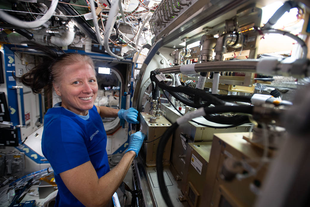 Astronaut Shannon Walker sets up the Packed Bed Reactor Experiment
