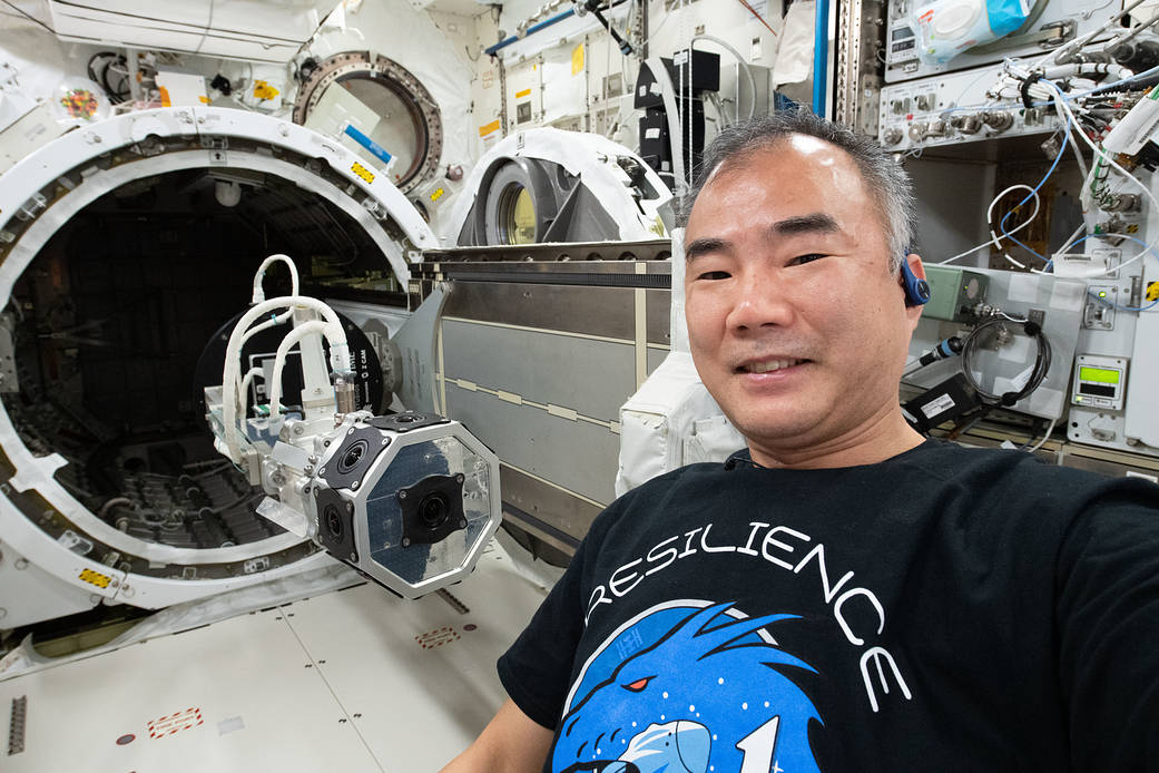 Astronaut Soichi Noguchi installs a 3D virtual reality camera