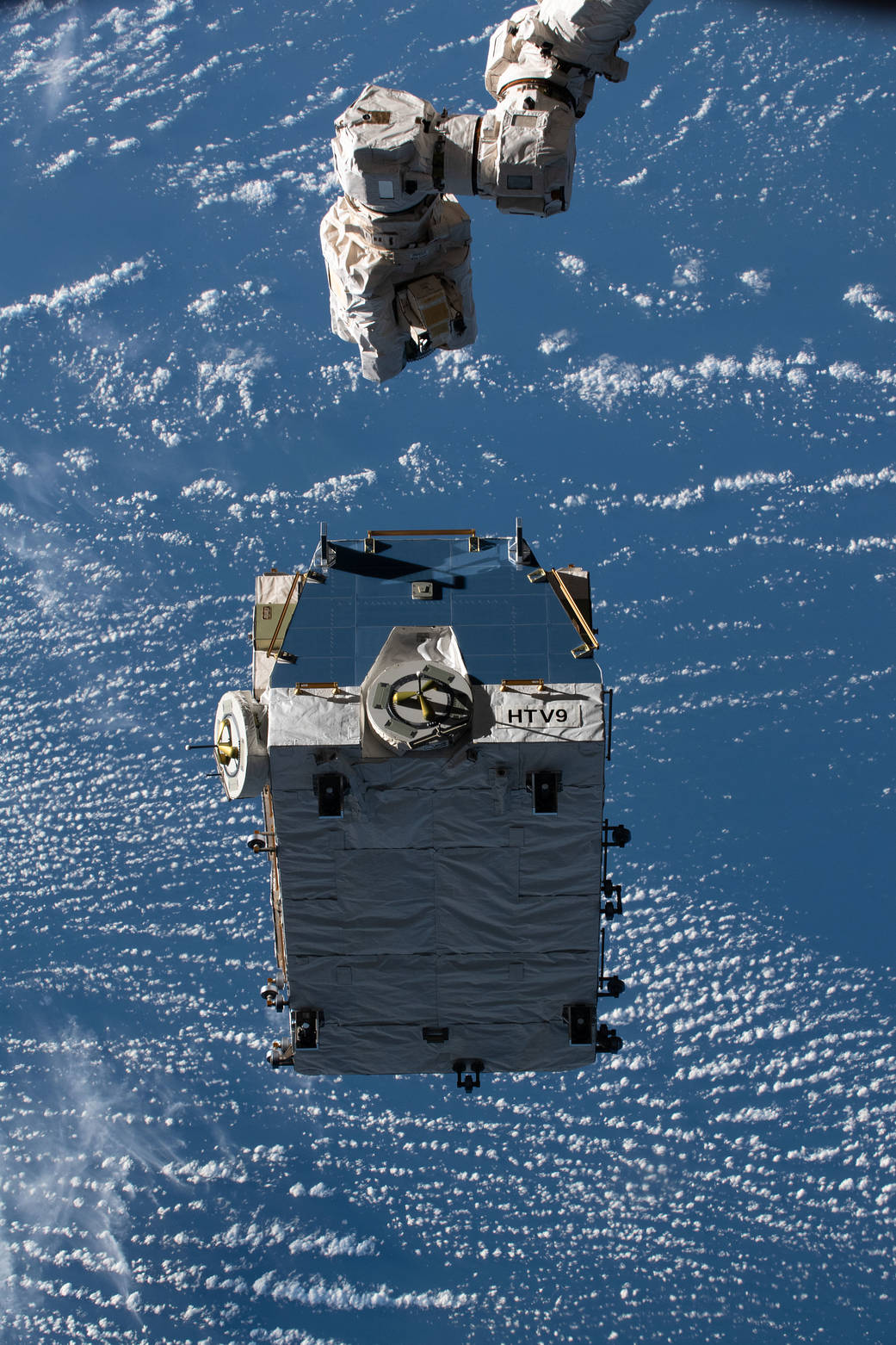An external pallet is released from the Canadarm2 robotic arm