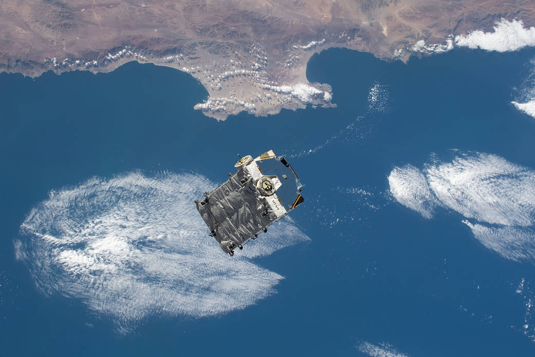 An external pallet is released from the Canadarm2 robotic arm