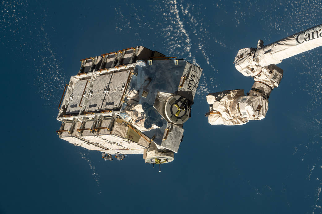 An external pallet is released from the Canadarm2 robotic arm