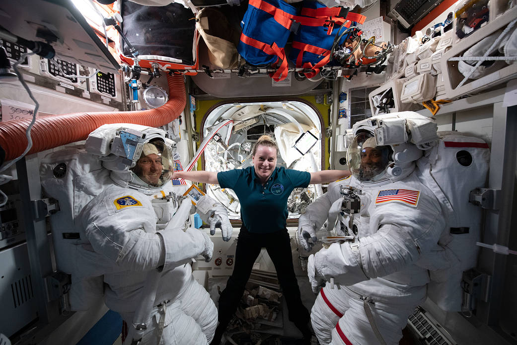 Playful portrait with NASA astronauts in Quest airlock