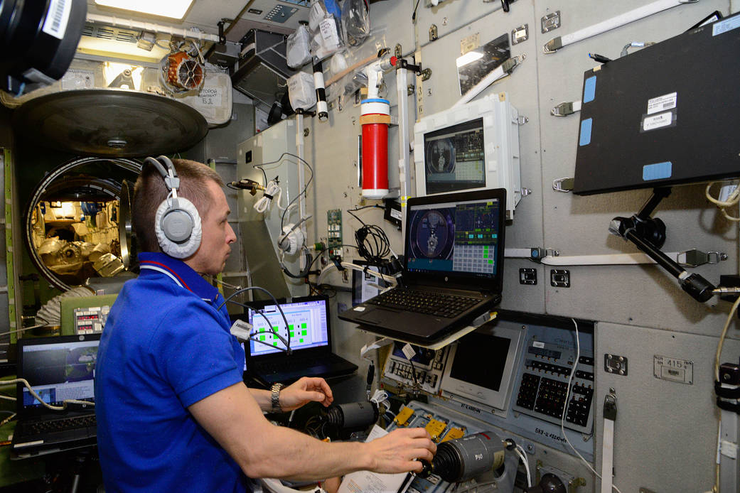 Expedition 64 Commander Sergey Ryzhikov works inside the Zvezda service module