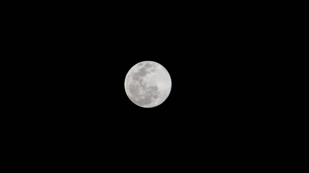 Full Moon above the Earth's horizon