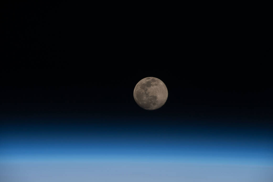 Full Moon above the Earth's horizon