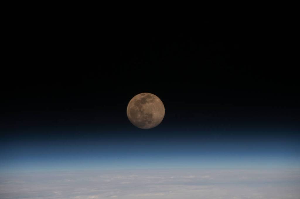 A Full Moon above the Earth’s horizon