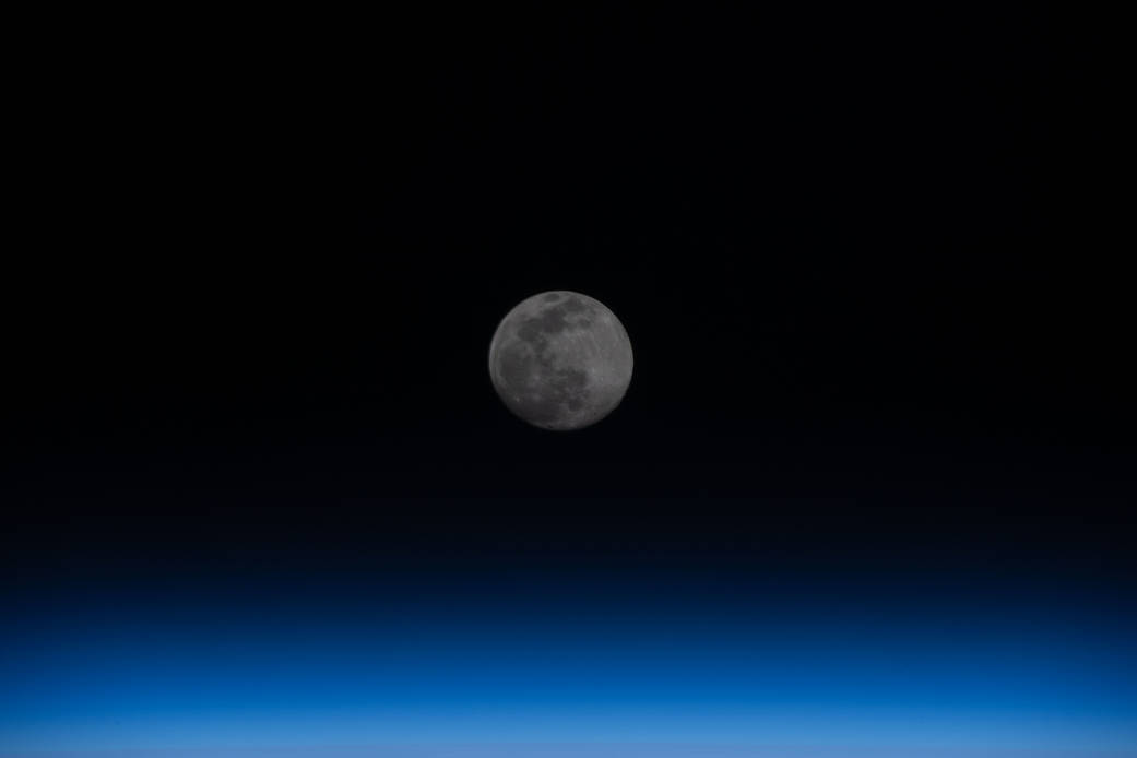 Full Moon above the Earth's horizon