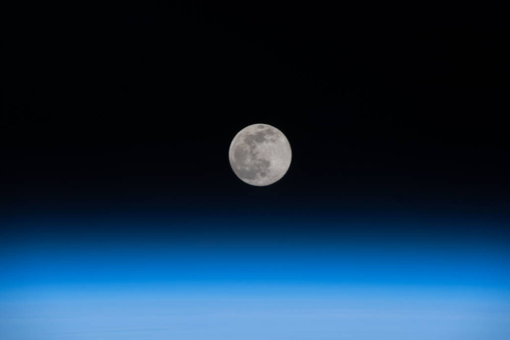 Full Moon above the Earth's horizon