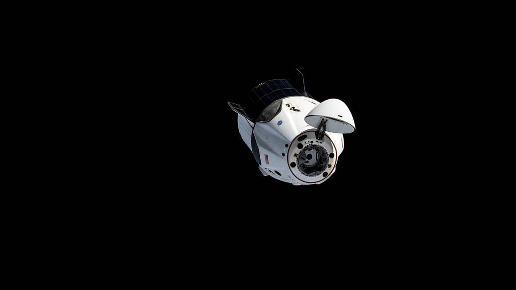 The SpaceX Crew Dragon maneuvers to another port