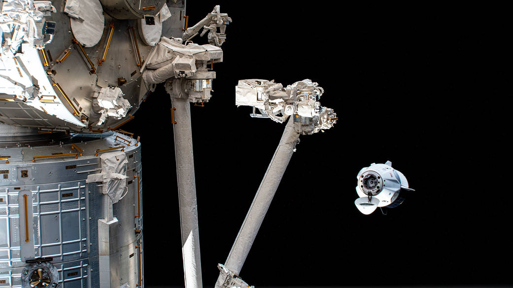 The SpaceX Crew Dragon maneuvers to another port