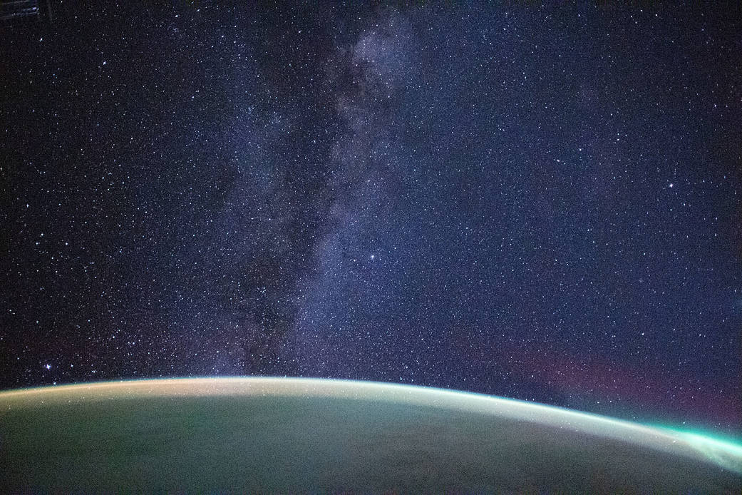 The Milky Way extends above the Earth's horizon