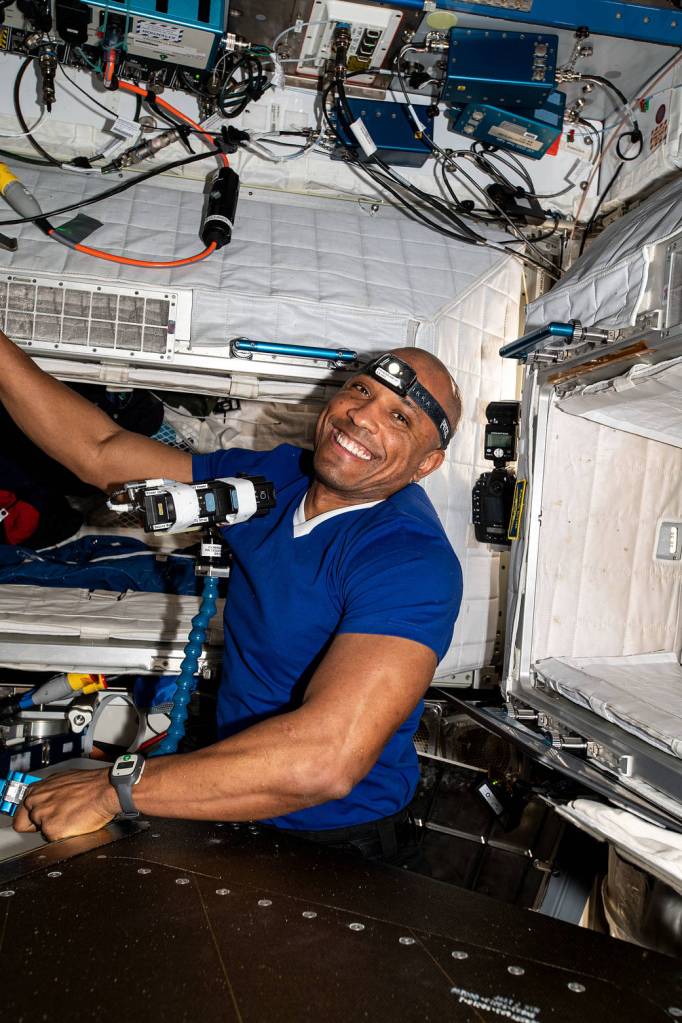 NASA astronaut Victor Glover routes ethernet cables