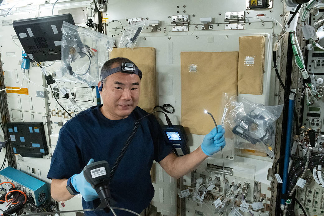 Astronaut Soichi Noguchi conducts station maintenance work